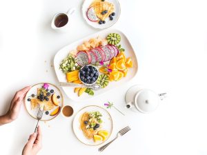 Some mix fruit salad in the white plate