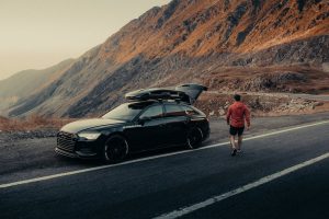 A scenic road trip with a car, symbolising the importance of choosing the best car insurance for safe travels